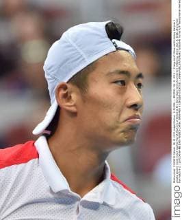 (151008) -- BEIJING, Oct. 8, 2015 -- Zhang Ze of China reacts during the men s singles second round match against Novak Djokovic of Serbia at the China Open tennis tournament in Beijing, China, Oct. 8, 2015. Zhang lost the match 0-2. ) (SP)CHINA-BEIJING-TENNIS-CHINA OPEN-MEN S SINGLES-DJOKOVIC LixWen 