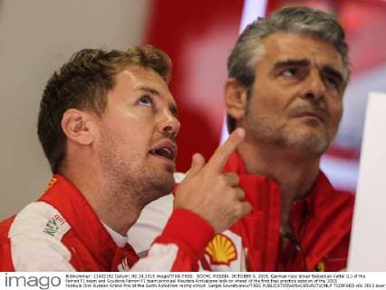 SOCHI, RUSSIA. OCTOBER 9, 2015. German race driver Sebastian Vettel (L) of the Ferrari F1 team and Scuderia Ferrari F1 team principal Maurizio Arrivabene look on ahead of the first free practice session of the 2015 Formula One Russian Grand Prix at the Sochi Autodrom racing circuit. Sergei Savostyanov TASS  TS00F6ED