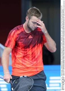 (151009) -- BEIJING, Oct. 9, 2015 -- Jack Sock of the United States reacts during the men s singles quarterfinal against Rafael Nadal of Spain at the China Open tennis tournament in Beijing, China, Oct. 9, 2015. Sock lost the match 1-2. ) (SP)CHINA-BEIJING-TENNIS-CHINA OPEN-MEN S SINGLES-NADAL XingxGuangli 