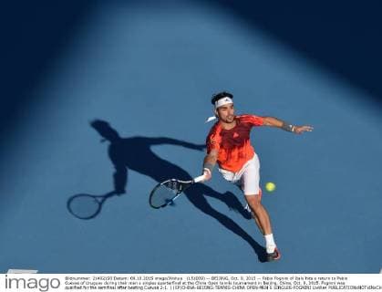 (151009) -- BEIJING, Oct. 9, 2015 -- Fabio Fognini of Italy hits a return to Pablo Cuevas of Uruguay during their men s singles quarterfinal at the China Open tennis tournament in Beijing, China, Oct. 9, 2015. Fognini was qualified for the semifinal after beating Cuevas 2-1. ) (SP)CHINA-BEIJING-TENNIS-CHINA OPEN-MEN S SINGLES-FOGNINI LixWen 