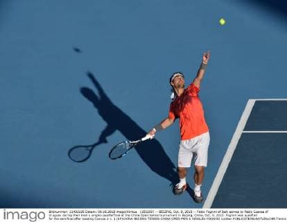 (151009) -- BEIJING, Oct. 9, 2015 -- Fabio Fognini of Italy serves to Pablo Cuevas of Uruguay during their men s singles quarterfinal at the China Open tennis tournament in Beijing, China, Oct. 9, 2015. Fognini was qualified for the semifinal after beating Cuevas 2-1. ) (SP)CHINA-BEIJING-TENNIS-CHINA OPEN-MEN S SINGLES-FOGNINI LixWen 