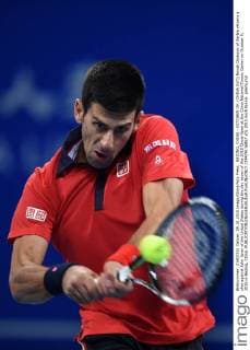 BEIJING, CHINA - OCTOBER 09: (CHINA OUT) Novak Djokovic of Serbia returns a shot against John Isner of the United States during the day seven of the 2015 China Open at the China National Tennis Center on October 9, 2015 in Beijing, China.  CFP474116857 