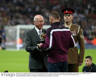 England s Wayne Rooney gets presented with a golden boot by Sir Bobby Charlton Euro 2016 Qualifier- England vs Estonia - Wembley Stadium - England - 9th October 2015 - Picture David Klein Sportimage EDITORIAL USE ONLY. No use with unauthorised audio, video, data, fixture lists, club league logos or live services. Online in-match use limited to 120 images, no video emulation. No use in betting, games or single club league player publications.