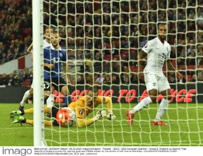 Football - 2015 2016 European Qualifier - Group E: England vs. Estonia Theo Walcott of England scores the opening goal past Mihkel Aksalu 0n the stroke of half time at Wembley. COLORSPORT ANDREW COWIE 
