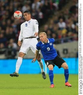 England s Chris Smalling tussles with Estonia s Ats Purje Euro 2016 Qualifier- England vs Estonia - Wembley Stadium - England - 9th October 2015 - Picture David Klein Sportimage EDITORIAL USE ONLY. No use with unauthorised audio, video, data, fixture lists, club league logos or live services. Online in-match use limited to 120 images, no video emulation. No use in betting, games or single club league player publications.