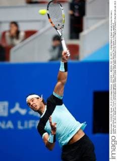 (151010) -- BEIJING, Oct. 10, 2015 -- Rafael Nadal of Spain serves during the men s singles semifinal of China Open Tennis Tournament against Fabio Fognini of Italy at the National Tennis Center in Beijing, capital of China, Oct. 10, 2015. Nadal won 2-0. ) (SP)CHINA-BEIJING-TENNIS-CHINA OPEN-MEN S SINGLES (CN) WangxLili 