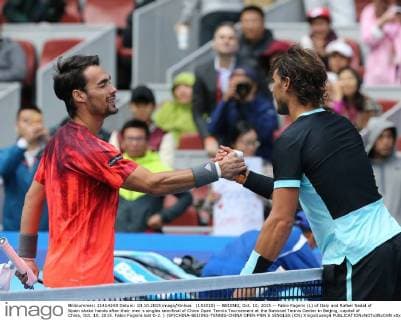 (151010) -- BEIJING, Oct. 10, 2015 -- Fabio Fognini (L) of Italy and Rafael Nadal of Spain shake hands after their men s singles semifinal of China Open Tennis Tournament at the National Tennis Center in Beijing, capital of China, Oct. 10, 2015. Fabio Fognini lost 0-2. ) (SP)CHINA-BEIJING-TENNIS-CHINA OPEN-MEN S SINGLES (CN) XingxGuangli 