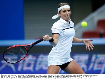 (151010) -- BEIJING, Oct. 10, 2015 -- Timea Bacsinszky of Switzerland hits a return to Ana Ivanovic of Serbia during the women s singles semifinal at 2015 China Open Tennis Tournament in Beijing, China, Oct. 10, 2015.) (SP)CHINA-BEIJING-TENNIS-CHINA OPEN-WOMEN S SINGLES WangxLili 