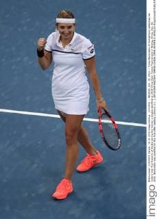 (151010) -- BEIJING, Oct. 10, 2015 -- Timea Bacsinszky of Switzerland celebrates her victory over Ana Ivanovic of Serbia during the women s singles semifinal at 2015 China Open Tennis Tournament in Beijing, China, Oct. 10, 2015. Bacsinszky was qualified for the final after beating Ivanovic 2-1. ) (SP)CHINA-BEIJING-TENNIS-CHINA OPEN-WOMEN S SINGLES XingxGuangli 