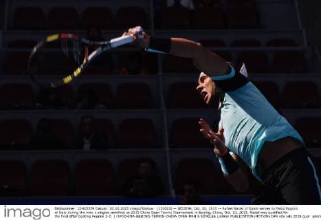 (151010) -- BEIJING, Oct. 10, 2015 -- Rafael Nadal of Spain serves to Fabio Fognini of Italy during the men s singles semifinal at 2015 China Open Tennis Tournament in Beijing, China, Oct. 10, 2015. Nadal was qualified for the final after beating Fognini 2-0. ) (SP)CHINA-BEIJING-TENNIS-CHINA OPEN-MEN S SINGLES LixWen 
