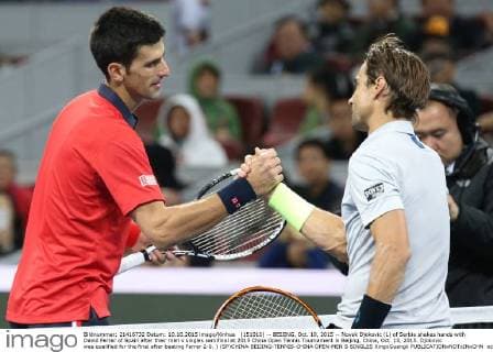 (151010) -- BEIJING, Oct. 10, 2015 -- Novak Djokovic (L) of Serbia shakes hands with David Ferrer of Spain after their men s singles semifinal at 2015 China Open Tennis Tournament in Beijing, China, Oct. 10, 2015. Djokovic was qualified for the final after beating Ferrer 2-0. ) (SP)CHINA-BEIJING-TENNIS-CHINA OPEN-MEN S SINGLES XingxGuangli 