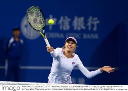 BEIJING, CHINA - OCTOBER 10: (CHINA OUT) Martina Hingis of Switzerland hits a return as she and partner Sania Mirza of India play in their women s doubles final match against Yung-Jan Chan of Taiwan and partner Hao-Ching Chan of Taiwan during the 2015 China Open tennis at the China National Tennis Centre on October 10, 2015 in Beijing, China.  CFP474184492 