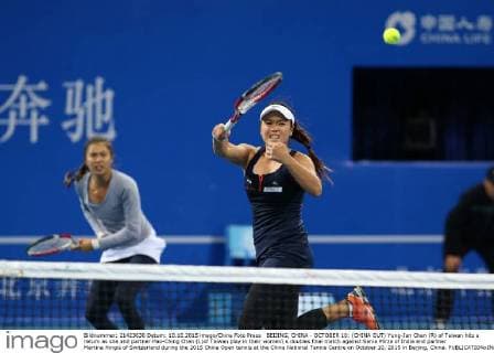 BEIJING, CHINA - OCTOBER 10: (CHINA OUT) Yung-Jan Chan (R) of Taiwan hits a return as she and partner Hao-Ching Chan (L)of Taiwan play in their women s doubles final match against Sania Mirza of India and partner Martina Hingis of Switzerland during the 2015 China Open tennis at the China National Tennis Centre on October 10, 2015 in Beijing, China.  CFP474184494 