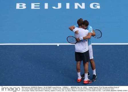 (151011) -- BEIJING, Oct. 11, 2015 -- Vasek Pospisil (R)of Canada and Jack Sock of the United States celebrate during the men s doubles final against Danel Nestor of Canada and Edouard Roger-Vasselin of France at 2015 China Open Tennis Tournament in Beijing, capital of China, Oct. 11, 2015. Pospisil and Sock won 2-1 to claim the title. ) (SP)CHINA-BEIJING-TENNIS-CHINA OPEN-MEN S DOUBLES XingxGuangli 