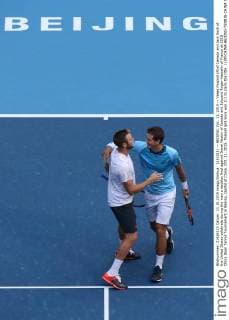 (151011) -- BEIJING, Oct. 11, 2015 -- Vasek Pospisil (R)of Canada and Jack Sock of the United States celebrate during the men s doubles final against Danel Nestor of Canada and Edouard Roger-Vasselin of France at 2015 China Open Tennis Tournament in Beijing, capital of China, Oct. 11, 2015. Pospisil and Sock won 2-1 to claim the title. ) (SP)CHINA-BEIJING-TENNIS-CHINA OPEN-MEN S DOUBLES XingxGuangli 