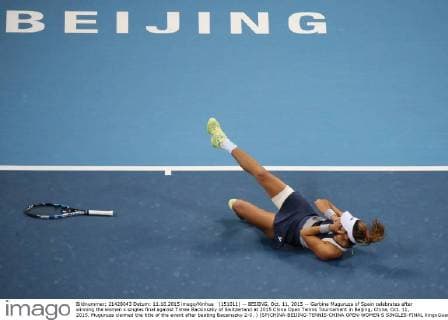 (151011) -- BEIJING, Oct. 11, 2015 -- Garbine Muguruza of Spain celebrates after winning the women s singles final against Timea Bacsinszky of Switzerland at 2015 China Open Tennis Tournament in Beijing, China, Oct. 11, 2015. Muguruza claimed the title of the event after beating Bacsinszky 2-0. ) (SP)CHINA-BEIJING-TENNIS-CHINA OPEN-WOMEN S SINGLES-FINAL XingxGuangli 