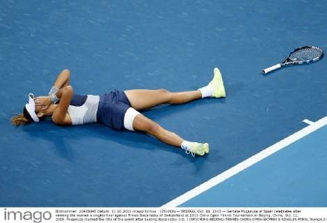 (151011) -- BEIJING, Oct. 11, 2015 -- Garbine Muguruza of Spain celebrates after winning the women s singles final against Timea Bacsinszky of Switzerland at 2015 China Open Tennis Tournament in Beijing, China, Oct. 11, 2015. Muguruza claimed the title of the event after beating Bacsinszky 2-0. ) (SP)CHINA-BEIJING-TENNIS-CHINA OPEN-WOMEN S SINGLES-FINAL WangxLili 