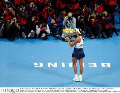 (151011) -- BEIJING, Oct. 11, 2015 -- Garbine Muguruza of Spain kisses her champion trophy during the awarding ceremony for the women s singles final at 2015 China Open Tennis Tournament in Beijing, China, Oct. 11, 2015. Muguruza claimed the title of the event after beating Timea Bacsinszky of Switzerland 2-0. ) (SP)CHINA-BEIJING-TENNIS-CHINA OPEN-WOMEN S SINGLES-FINAL WangxLili 