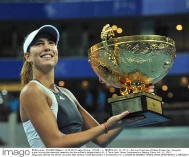 (151011) -- BEIJING, Oct. 11, 2015 -- Garbine Muguruza of Spain displays her champion trophy during the awarding ceremony for the women s singles final at 2015 China Open Tennis Tournament in Beijing, China, Oct. 11, 2015. Muguruza claimed the title of the event after beating Timea Bacsinszky of Switzerland 2-0. ) (SP)CHINA-BEIJING-TENNIS-CHINA OPEN-WOMEN S SINGLES-FINAL LixWen 