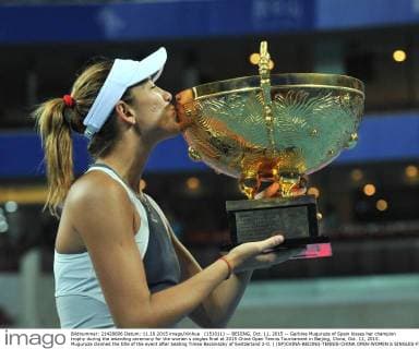 (151011) -- BEIJING, Oct. 11, 2015 -- Garbine Muguruza of Spain kisses her champion trophy during the awarding ceremony for the women s singles final at 2015 China Open Tennis Tournament in Beijing, China, Oct. 11, 2015. Muguruza claimed the title of the event after beating Timea Bacsinszky of Switzerland 2-0. ) (SP)CHINA-BEIJING-TENNIS-CHINA OPEN-WOMEN S SINGLES-FINAL LixWen 