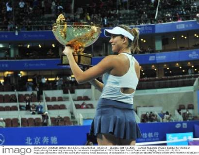 (151011) -- BEIJING, Oct. 11, 2015 -- Garbine Muguruza of Spain displays her champion trophy during the awarding ceremony for the women s singles final at 2015 China Open Tennis Tournament in Beijing, China, Oct. 11, 2015. Muguruza claimed the title of the event after beating Timea Bacsinszky of Switzerland 2-0. ) (SP)CHINA-BEIJING-TENNIS-CHINA OPEN-WOMEN S SINGLES-FINAL LixWen 
