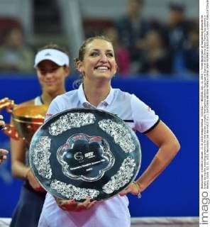 (151011) -- BEIJING, Oct. 11, 2015 -- Timea Bacsinszky of Switzerland displayes his trophy during the awarding ceremony for the women s singles final against Garbine Muguruza of Spain at 2015 China Open Tennis Tournament in Beijing, China, Oct. 11, 2015. Bacsinszky lost the match 0-2. ) (SP)CHINA-BEIJING-TENNIS-CHINA OPEN-WOMEN S SINGLES-FINAL LixWen 