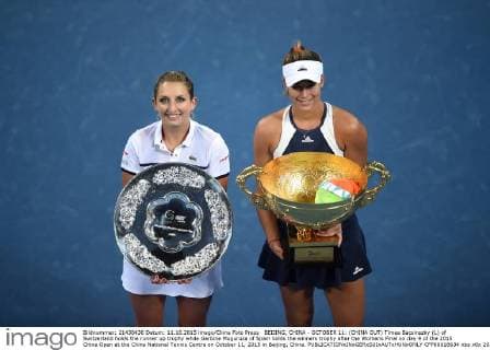 BEIJING, CHINA - OCTOBER 11: (CHINA OUT) Timea Bacsinszky (L) of Switzerland holds the runner up trophy while Garbine Muguruza of Spain holds the winners trophy after the Womens Final on day 9 of the 2015 China Open at the China National Tennis Centre on October 11, 2015 in Beijing, China.  CFP66018634 
