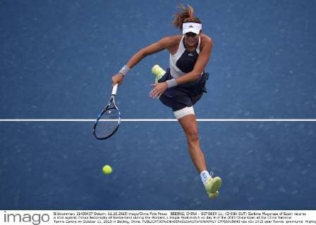 BEIJING, CHINA - OCTOBER 11: (CHINA OUT) Garbine Muguruza of Spain returns a shot against Timea Bacsinszky of Switzerland during the Women s Single Final match on day 9 of the 2015 China Open at the China National Tennis Centre on October 11, 2015 in Beijing, China.  CFP66018643 