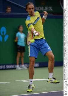 Alexandr Dolgopolov of Ukraine returns a shot to Borna Coric of Coratia in their first round match of the men s singles during the 2015 Shanghai Rolex Masters tennis tournament in Shanghai, China, 11 October 2015. Borna Coric of Coratia defeated Alexandr Dolgopolov of Ukraine 2-1 (6-3 1-6 7-6) in their first round match of the men s singles during the 2015 Shanghai Rolex Masters tennis tournament in Shanghai, China, 11 October 2015. Borna Coric kicks out Alexandr Dolgopolov at Shanghai Rolex Masters  20151011_49253
