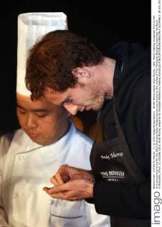 British tennis player Andy Murray, right, learns making dumplings from a chef at a promotional event for the 2015 Shanghai Rolex Masters tennis tournament on the rooftop of The Peninsula Shanghai hotel near the Bund in Shanghai, China, 11 October 2015. Andy Murray prepares for Shanghai Masters by making dumplings  pbu343612_38