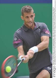 Martin Klizan of Slovakia returns a shot to Zhang Ze of China in their first round match of the men s singles during the 2015 Shanghai Rolex Masters tennis tournament in Shanghai, China, 12 October 2015. Martin Klizan defeated Zhang Ze of China 2-0 (7-6 6-2) in their first round match of the men s singles during the 2015 Shanghai Rolex Masters tennis tournament in Shanghai, China, 12 October 2015. Martin Klizan ousts Zhang Ze at Shanghai Rolex Masters  pbu343945_02