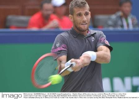 Martin Klizan of Slovakia returns a shot to Zhang Ze of China in their first round match of the men s singles during the 2015 Shanghai Rolex Masters tennis tournament in Shanghai, China, 12 October 2015. Martin Klizan defeated Zhang Ze of China 2-0 (7-6 6-2) in their first round match of the men s singles during the 2015 Shanghai Rolex Masters tennis tournament in Shanghai, China, 12 October 2015. Martin Klizan ousts Zhang Ze at Shanghai Rolex Masters  pbu343945_12