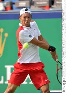Zhang Ze of China returns a shot to Martin Klizan of Slovakia in their first round match of the men s singles during the 2015 Shanghai Rolex Masters tennis tournament in Shanghai, China, 12 October 2015. Martin Klizan defeated Zhang Ze of China 2-0 (7-6 6-2) in their first round match of the men s singles during the 2015 Shanghai Rolex Masters tennis tournament in Shanghai, China, 12 October 2015. Martin Klizan ousts Zhang Ze at Shanghai Rolex Masters  pbu343943_02