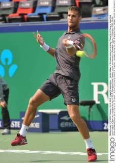 Martin Klizan of Slovakia returns a shot to Zhang Ze of China in their first round match of the men s singles during the 2015 Shanghai Rolex Masters tennis tournament in Shanghai, China, 12 October 2015. Martin Klizan defeated Zhang Ze of China 2-0 (7-6 6-2) in their first round match of the men s singles during the 2015 Shanghai Rolex Masters tennis tournament in Shanghai, China, 12 October 2015. Martin Klizan ousts Zhang Ze at Shanghai Rolex Masters  pbu343943_07