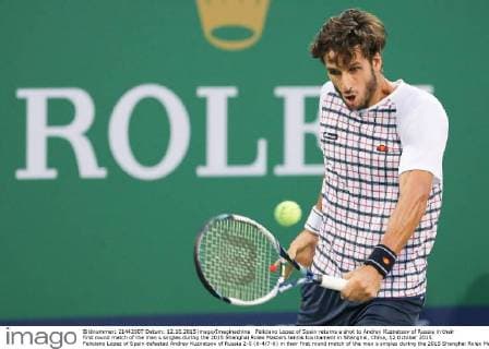Feliciano Lopez of Spain returns a shot to Andrey Kuznetsov of Russia in their first round match of the men s singles during the 2015 Shanghai Rolex Masters tennis tournament in Shanghai, China, 12 October 2015. Feliciano Lopez of Spain defeated Andrey Kuznetsov of Russia 2-0 (6-4 7-6) in their first round match of the men s singles during the 2015 Shanghai Rolex Masters tennis tournament in Shanghai, China, 12 October 2015. Feliciano Lopez beats Andrey Kuznetsov at Shanghai Rolex Masters  20151012_11142