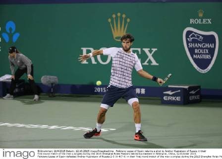Feliciano Lopez of Spain returns a shot to Andrey Kuznetsov of Russia in their first round match of the men s singles during the 2015 Shanghai Rolex Masters tennis tournament in Shanghai, China, 12 October 2015. Feliciano Lopez of Spain defeated Andrey Kuznetsov of Russia 2-0 (6-4 7-6) in their first round match of the men s singles during the 2015 Shanghai Rolex Masters tennis tournament in Shanghai, China, 12 October 2015. Feliciano Lopez beats Andrey Kuznetsov at Shanghai Rolex Masters  20151012_33293