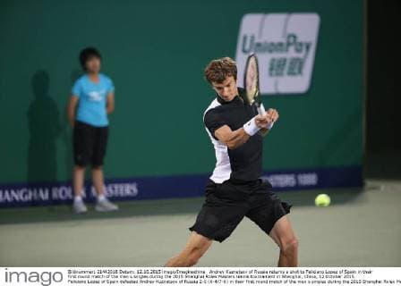 Andrey Kuznetsov of Russia returns a shot to Feliciano Lopez of Spain in their first round match of the men s singles during the 2015 Shanghai Rolex Masters tennis tournament in Shanghai, China, 12 October 2015. Feliciano Lopez of Spain defeated Andrey Kuznetsov of Russia 2-0 (6-4 7-6) in their first round match of the men s singles during the 2015 Shanghai Rolex Masters tennis tournament in Shanghai, China, 12 October 2015. Feliciano Lopez beats Andrey Kuznetsov at Shanghai Rolex Masters  20151012_64602