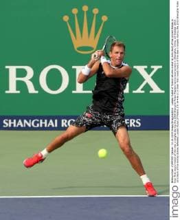 Lukasz Kubot of Poland returns a shot to John Sock of the United States in their first round match of the men s singles during the 2015 Shanghai Rolex Masters tennis tournament in Shanghai, China, 13 October 2015. John Sock of the United States defeated Lukasz Kubot of Poland 2-0 (6-4 6-2) in their first round match of the men s singles during the 2015 Shanghai Rolex Masters tennis tournament in Shanghai, China, 13 October 2015. John Sock eliminates Lukasz Kubot at Shanghai Rolex Masters  pbu344460_28