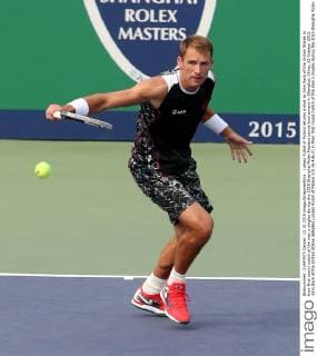 Lukasz Kubot of Poland returns a shot to John Sock of the United States in their first round match of the men s singles during the 2015 Shanghai Rolex Masters tennis tournament in Shanghai, China, 13 October 2015. John Sock of the United States defeated Lukasz Kubot of Poland 2-0 (6-4 6-2) in their first round match of the men s singles during the 2015 Shanghai Rolex Masters tennis tournament in Shanghai, China, 13 October 2015. John Sock eliminates Lukasz Kubot at Shanghai Rolex Masters  pbu344460_09