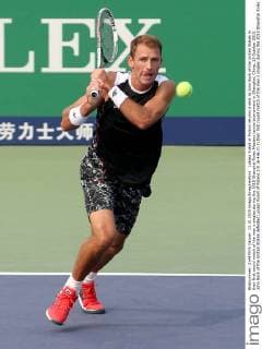 Lukasz Kubot of Poland returns a shot to John Sock of the United States in their first round match of the men s singles during the 2015 Shanghai Rolex Masters tennis tournament in Shanghai, China, 13 October 2015. John Sock of the United States defeated Lukasz Kubot of Poland 2-0 (6-4 6-2) in their first round match of the men s singles during the 2015 Shanghai Rolex Masters tennis tournament in Shanghai, China, 13 October 2015. John Sock eliminates Lukasz Kubot at Shanghai Rolex Masters  pbu344460_13