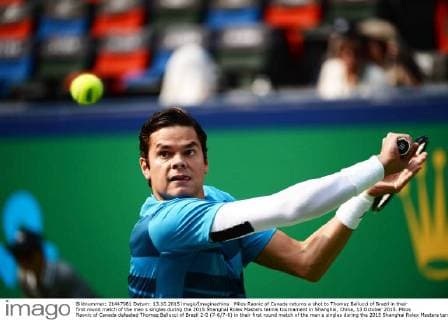 Milos Raonic of Canada returns a shot to Thomaz Bellucci of Brazil in their first round match of the men s singles during the 2015 Shanghai Rolex Masters tennis tournament in Shanghai, China, 13 October 2015. Milos Raonic of Canada defeated Thomaz Bellucci of Brazil 2-0 (7-6 7-6) in their first round match of the men s singles during the 2015 Shanghai Rolex Masters tennis tournament in Shanghai, China, 13 October 2015. Milos Raonic ousts Thomaz Bellucci at Shanghai Rolex Masters  20151013_63539