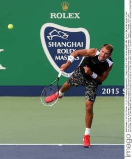 Lukasz Kubot of Poland serves against John Sock of the United States in their first round match of the men s singles during the 2015 Shanghai Rolex Masters tennis tournament in Shanghai, China, 13 October 2015. John Sock of the United States defeated Lukasz Kubot of Poland 2-0 (6-4 6-2) in their first round match of the men s singles during the 2015 Shanghai Rolex Masters tennis tournament in Shanghai, China, 13 October 2015. John Sock eliminates Lukasz Kubot at Shanghai Rolex Masters  pbu344460_14