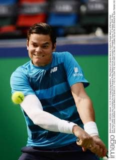 Milos Raonic of Canada returns a shot to Thomaz Bellucci of Brazil in their first round match of the men s singles during the 2015 Shanghai Rolex Masters tennis tournament in Shanghai, China, 13 October 2015. Milos Raonic of Canada defeated Thomaz Bellucci of Brazil 2-0 (7-6 7-6) in their first round match of the men s singles during the 2015 Shanghai Rolex Masters tennis tournament in Shanghai, China, 13 October 2015. Milos Raonic ousts Thomaz Bellucci at Shanghai Rolex Masters  20151013_09741