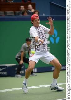 Tommy Haas of Germany returns a shot to Kevin Anderson of South Africa in their first round match of the men s singles during the 2015 Shanghai Rolex Masters tennis tournament in Shanghai, China, 13 October 2015. Kevin Anderson of South Africa defeated Tommy Haas of Germany 2-0 (6-3 7-5) in their first round match of the men s singles during the 2015 Shanghai Rolex Masters tennis tournament in Shanghai, China, 13 October 2015. Kevin Anderson defeats Tommy Haas at Shanghai Rolex Masters  20151013_33607