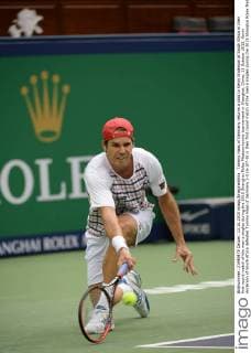 Tommy Haas of Germany returns a shot to Kevin Anderson of South Africa in their first round match of the men s singles during the 2015 Shanghai Rolex Masters tennis tournament in Shanghai, China, 13 October 2015. Kevin Anderson of South Africa defeated Tommy Haas of Germany 2-0 (6-3 7-5) in their first round match of the men s singles during the 2015 Shanghai Rolex Masters tennis tournament in Shanghai, China, 13 October 2015. Kevin Anderson defeats Tommy Haas at Shanghai Rolex Masters  20151013_11199