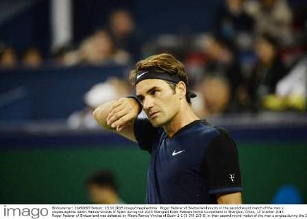 Roger Federer of Switzerland reacts in the second round match of the men s singles against Albert Ramos-Vinolas of Spain during the 2015 Shanghai Rolex Masters tennis tournament in Shanghai, China, 13 October 2015. Roger Federer of Switzerland was defeated by Albert Ramos-Vinolas of Spain 1-2 (6-7 6-2 3-6) in their second round match of the men s singles during the 2015 Shanghai Rolex Masters tennis tournament in Shanghai, China, 13 October 2015. Roger Federer kicked out by Albert Ramos-Vinolas at Shanghai Rolex Masters  20151013_13316