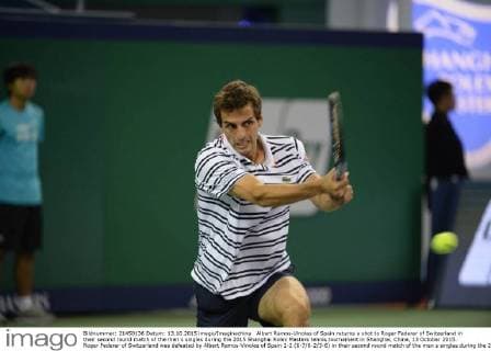Albert Ramos-Vinolas of Spain returns a shot to Roger Federer of Switzerland in their second round match of the men s singles during the 2015 Shanghai Rolex Masters tennis tournament in Shanghai, China, 13 October 2015. Roger Federer of Switzerland was defeated by Albert Ramos-Vinolas of Spain 1-2 (6-7 6-2 3-6) in their second round match of the men s singles during the 2015 Shanghai Rolex Masters tennis tournament in Shanghai, China, 13 October 2015. Roger Federer kicked out by Albert Ramos-Vinolas at Shanghai Rolex Masters  20151013_66707