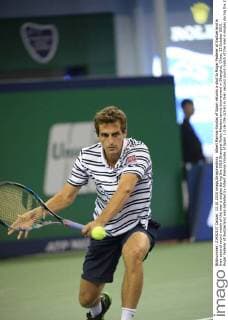 Albert Ramos-Vinolas of Spain returns a shot to Roger Federer of Switzerland in their second round match of the men s singles during the 2015 Shanghai Rolex Masters tennis tournament in Shanghai, China, 13 October 2015. Roger Federer of Switzerland was defeated by Albert Ramos-Vinolas of Spain 1-2 (6-7 6-2 3-6) in their second round match of the men s singles during the 2015 Shanghai Rolex Masters tennis tournament in Shanghai, China, 13 October 2015. Roger Federer kicked out by Albert Ramos-Vinolas at Shanghai Rolex Masters  20151013_66708