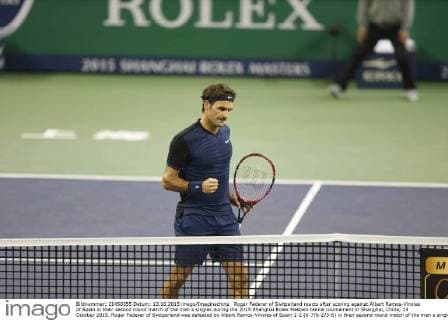 Roger Federer of Switzerland reacts after scoring against Albert Ramos-Vinolas of Spain in their second round match of the men s singles during the 2015 Shanghai Rolex Masters tennis tournament in Shanghai, China, 13 October 2015. Roger Federer of Switzerland was defeated by Albert Ramos-Vinolas of Spain 1-2 (6-7 6-2 3-6) in their second round match of the men s singles during the 2015 Shanghai Rolex Masters tennis tournament in Shanghai, China, 13 October 2015. Roger Federer kicked out by Albert Ramos-Vinolas at Shanghai Rolex Masters  20151013_51033