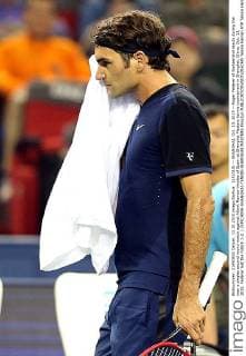 (151013) -- SHANGHAI, Oct. 13, 2015 -- Roger Federer of Switzerland reacts during the men s singles second round match against Albert Ramos-Vinolas of Spain at Shanghai Masters tennis tournament in Shanghai, China, Oct. 13, 2015. Federer lost the match 1-2. ) (SP)CHINA-SHANGHAI-TENNIS-SHANGHAI MASTERS FanxJun 